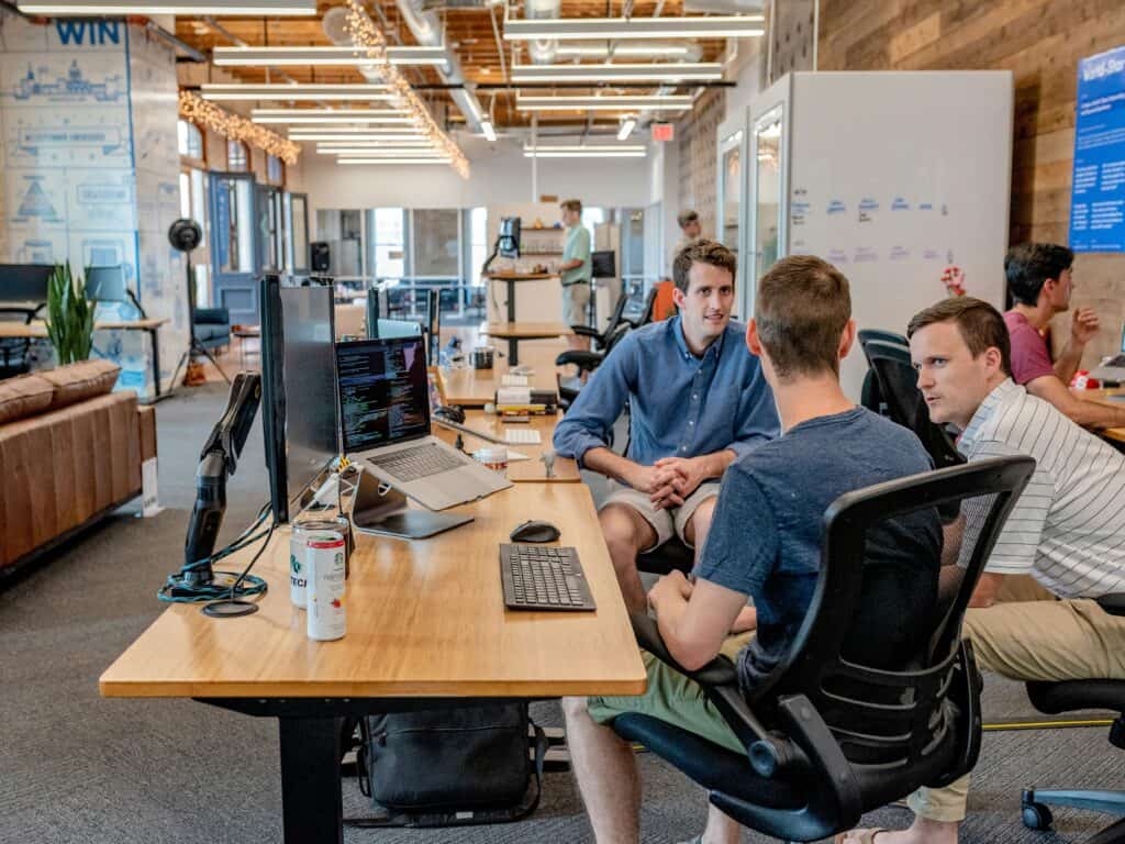Team of professionals collaborating in a modern office setting.