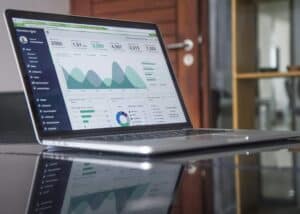 Business analytics dashboard on a laptop screen showing growth metrics.