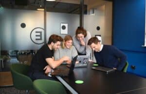 Team of professionals collaborating on a project at Digerati Inc office.