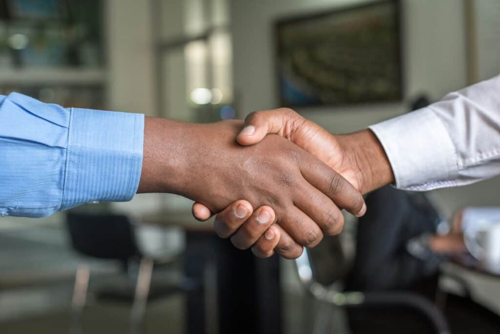 Business handshake symbolizing partnership and collaboration.