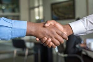 Business handshake symbolizing partnership and collaboration.