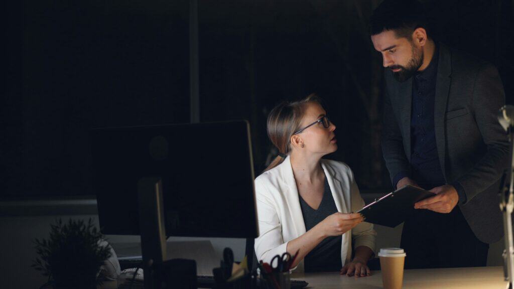 Business professionals discussing at Digerati Inc office.